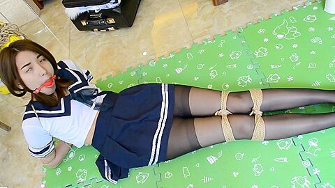 Student girl bound and ball gagged...