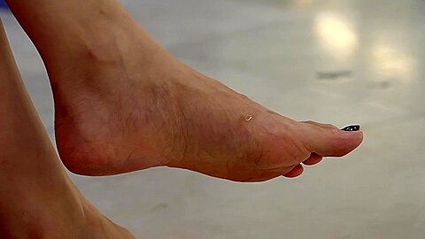 Beautiful Female Asian Feet With Black Nail Polish...