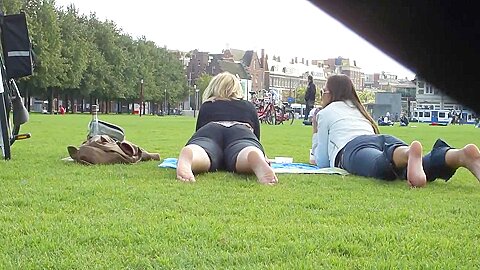 Two Hot Young Ladies Get Their Cute Bare Feet Filmed On The Grass...