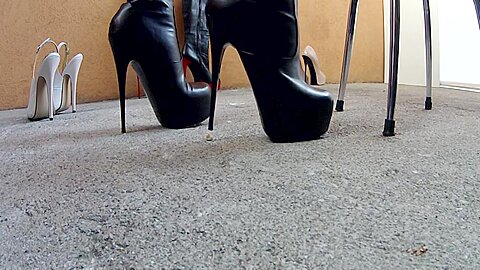 Sexy black boots crushing some tiny...