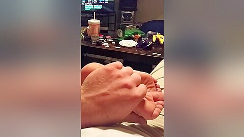 Enjoy Massaging My Amateur Babes Fantastic Feet While Playing Video Games