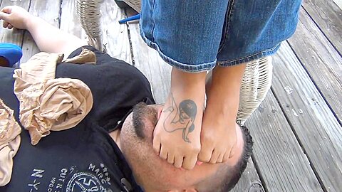 Stunning mistress tattooed feet tramples her...