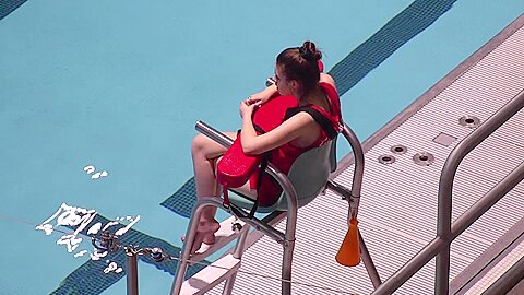 Hot female lifeguard exposes at the...