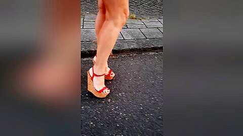 Red High Heels Wedge Walking In Street...
