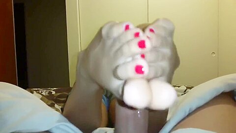 Girlfriend with red toe nails giving...