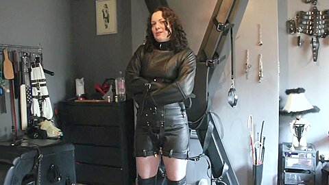 Girl Strapped Into A Fetters Leather Straitjacket...