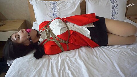 Asian In Red Suit Bound And Gagged...
